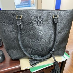 Tory Burch black leather purse, gently used. One small scuff one the front.